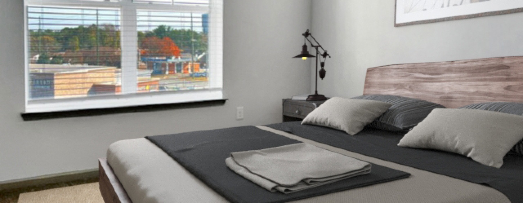 Bedroom of A4 floor plan with large window and bed