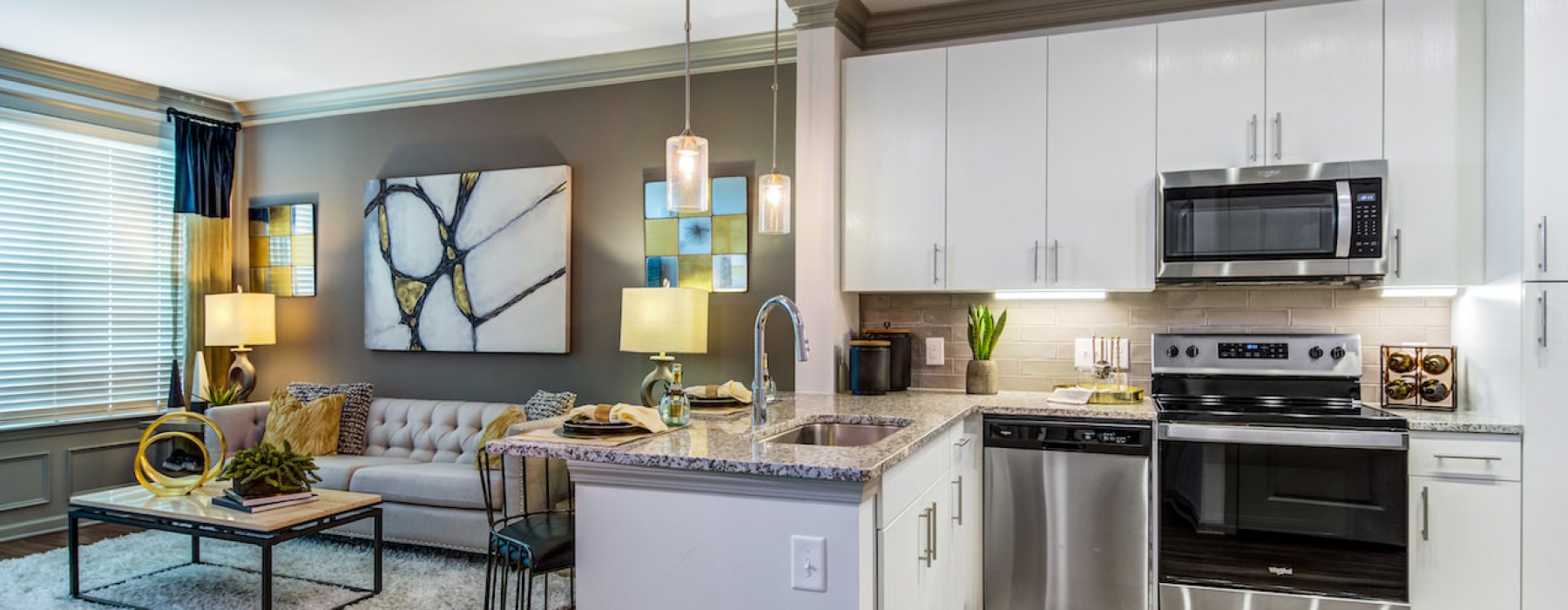 Stunning kitchen with stainless appliances and granite countertops at Marketplace Village