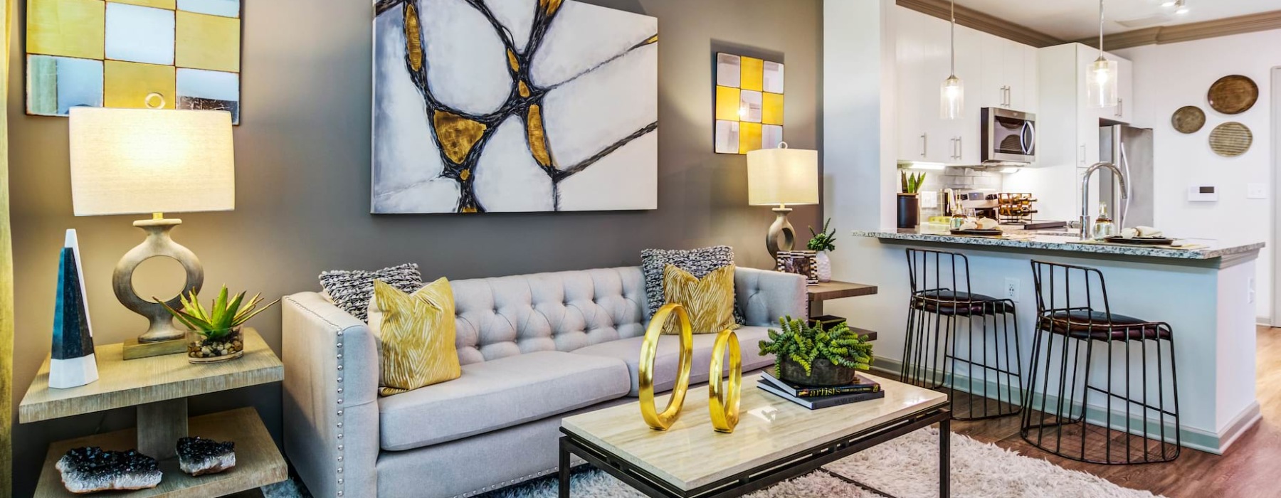 Modern one and two-bedroom apartment floor plans at Marketplace Village featuring an open-concept living room, kitchen island, and contemporary finishes in Marietta, Georgia.